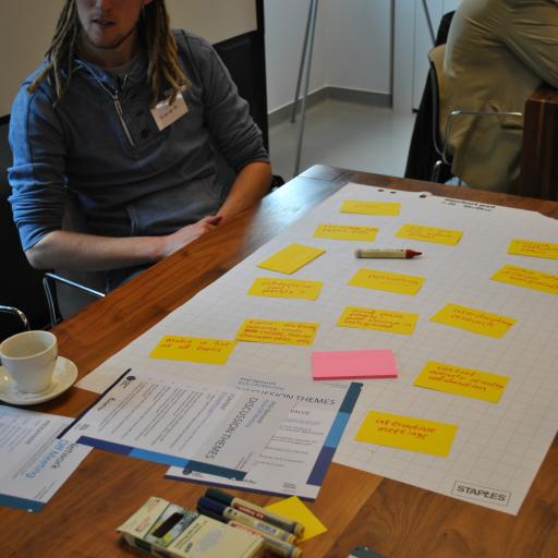 Picture of a poster presentation with post-its