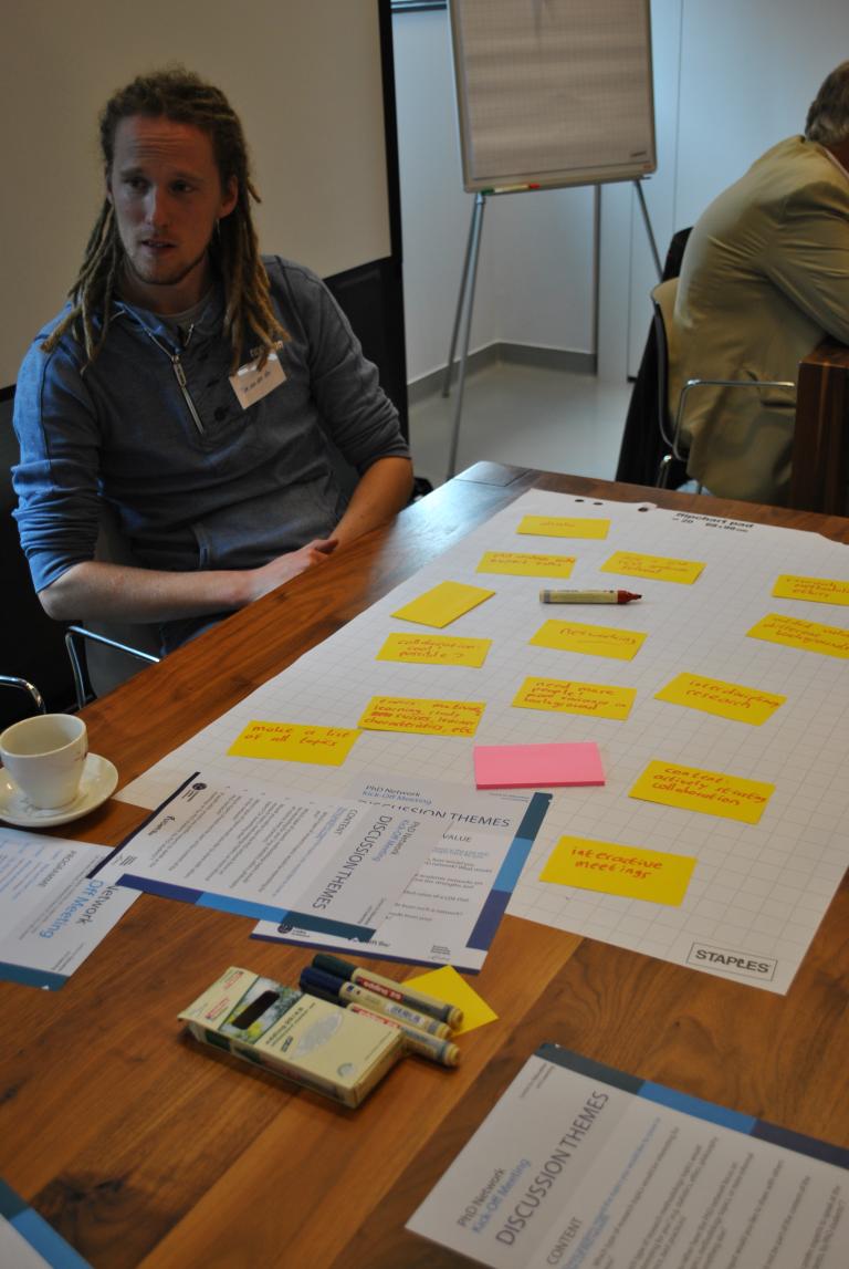 Picture of a poster presentation with post-its
